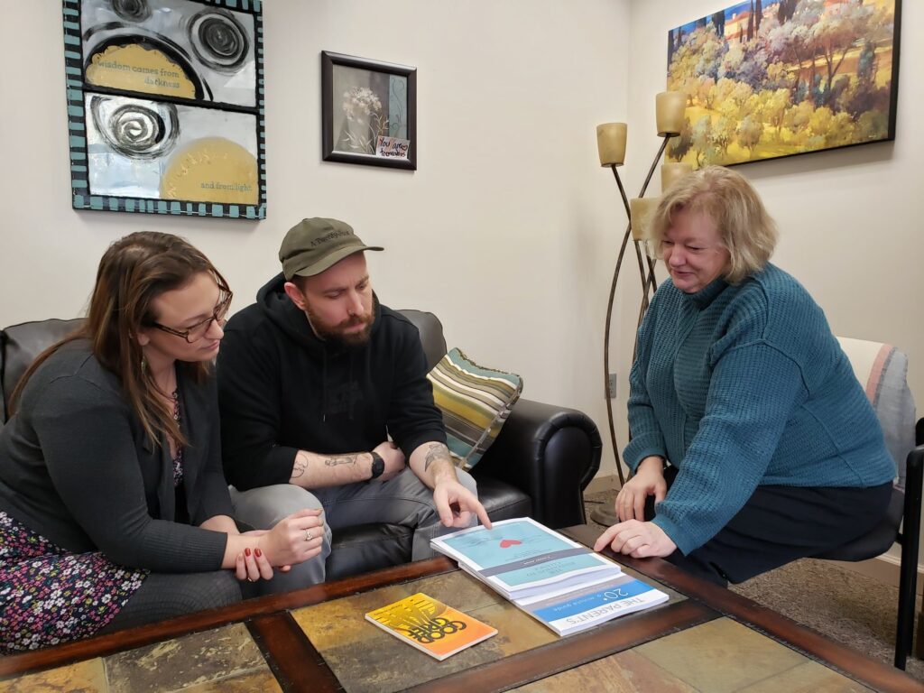 Family Support Navigator Image of Prevention Council Family Support Navigator talking with family about addiction.